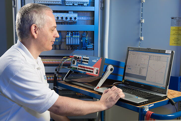 HPS employee analyzes test results on the computer