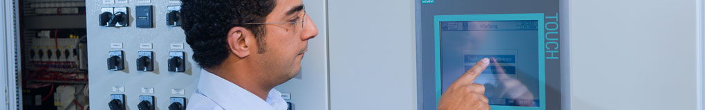 HPS - Man operates a control display